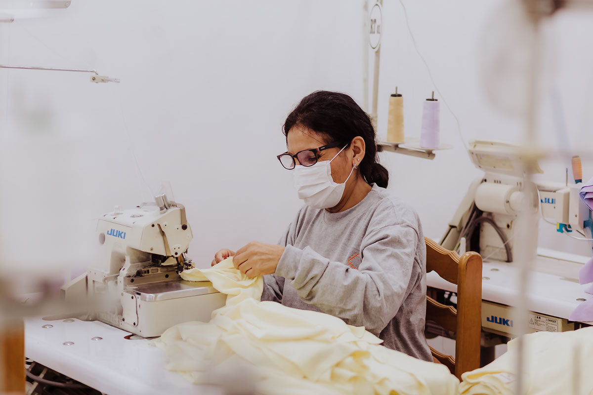 Person working at a sewing machine in a Rapozza workshop 